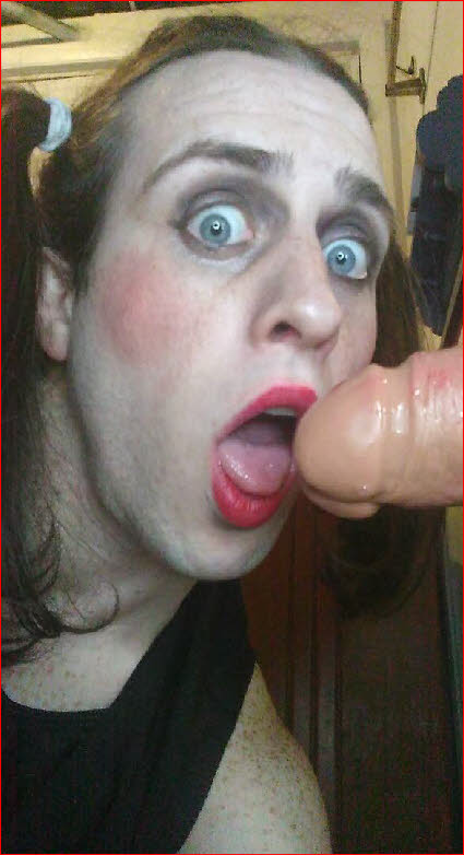 Sissy Lucy's eyes light up at the sight of a huge rubber dildo