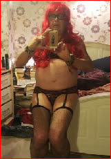 Gay sissy male exposed in stockings and suspenders