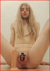 Caged sissy slut Amelie in long blonde wig