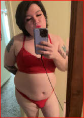 Sissy loser Desiree makes only a tiny bulge in his girlie red knickers