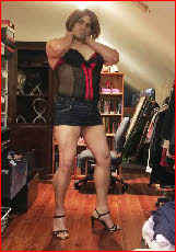 Mincing sissy Emma in short denim skirt