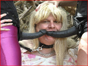 Sissy slut forced to swallow two big black strap-on dildos