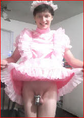Sissy Brandon lifts up fairy dress to expose tiny caged clit