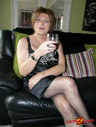 Mature British transvestite in black nightie