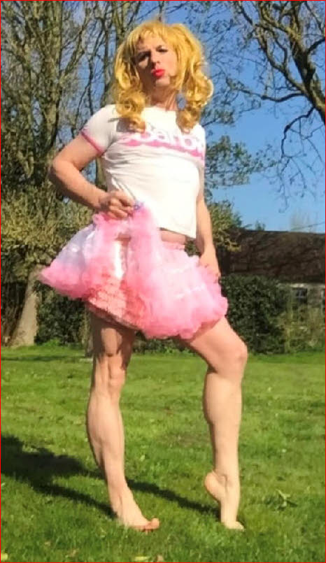 Mincing sissy Tara outside in frilly pink skirt