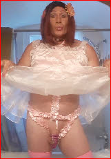 Gay faggot Marquita hitches up his babydoll nightie to reveal caged dick