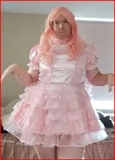 Sissy faggot Jessica in frilly pink frock with ruffles and frills